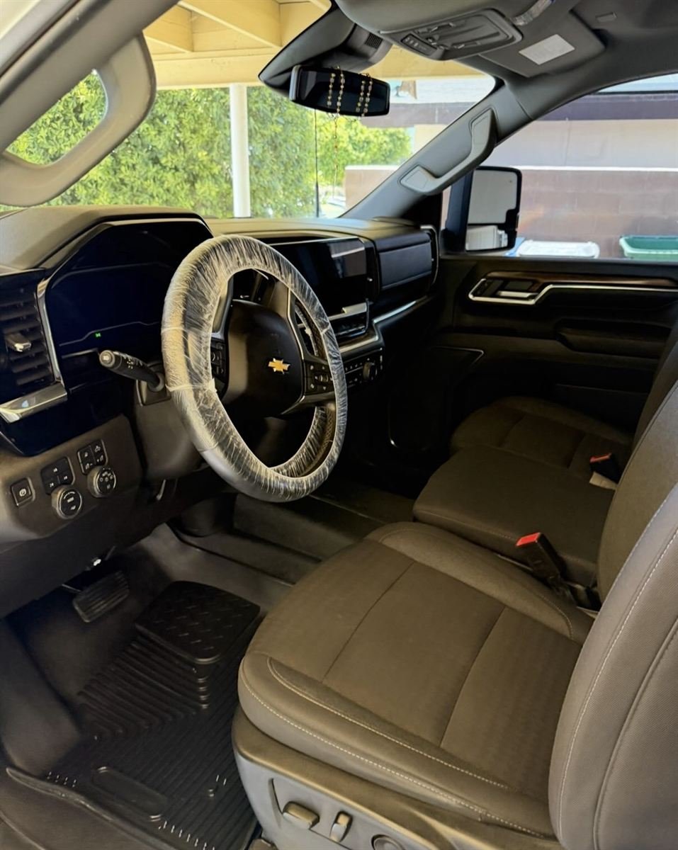 Chevrolet truck interior after detailing, clean floors and fresh steering wheel wrap