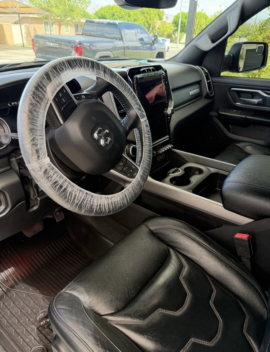 Detailed truck cabin with clean black leather seating