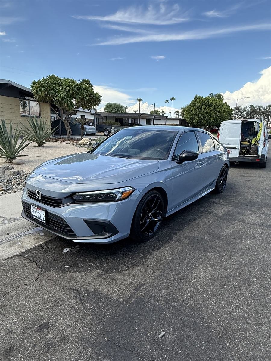 Silver Honda Civic sedan with a clean, glossy finish after detailing